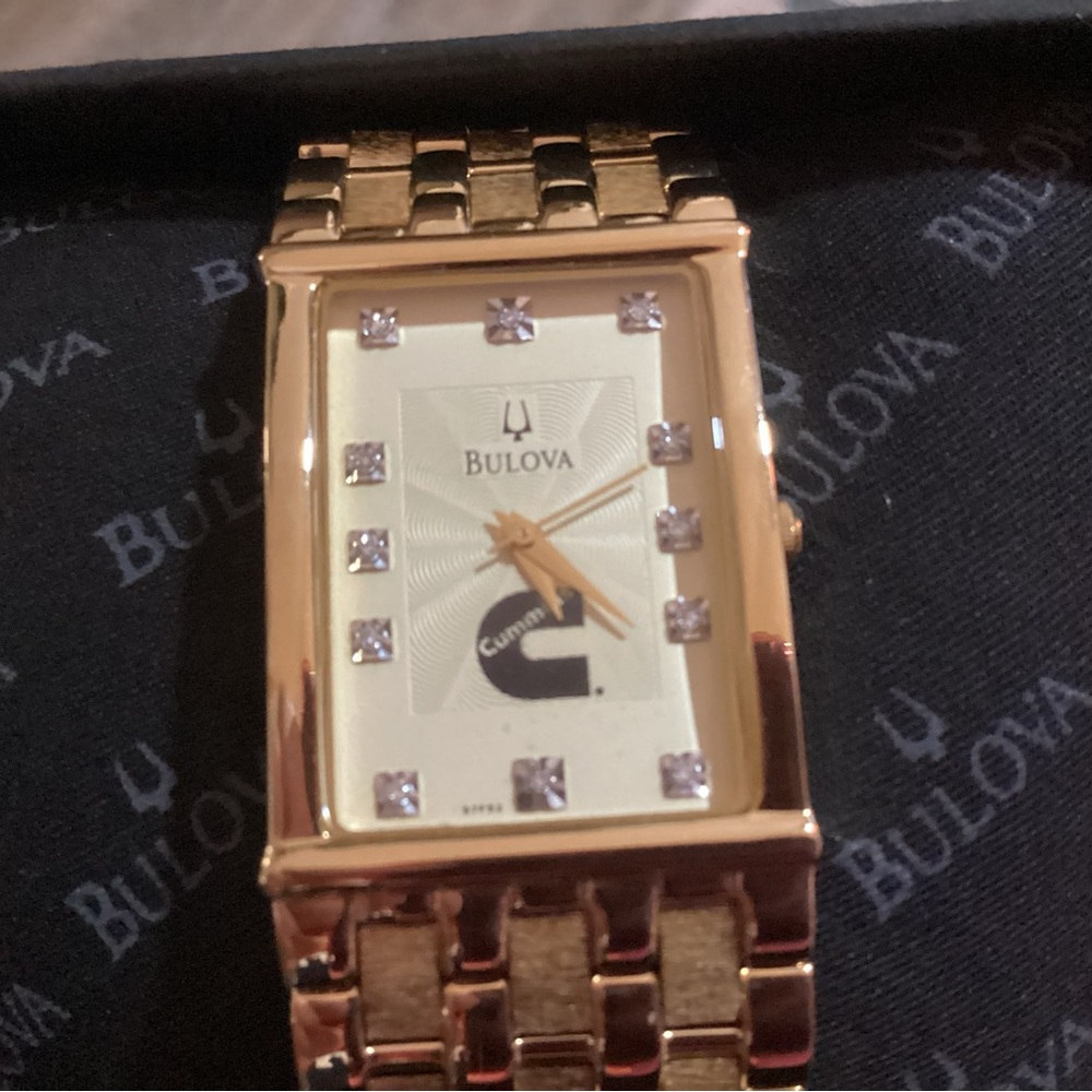 Bulova Gold watch - white face with diamonds